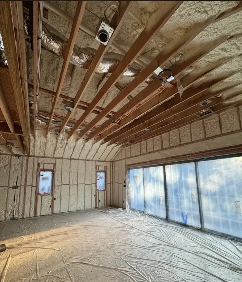 Interior walls and ceiling insulated with spray foam during new construction in Suitland